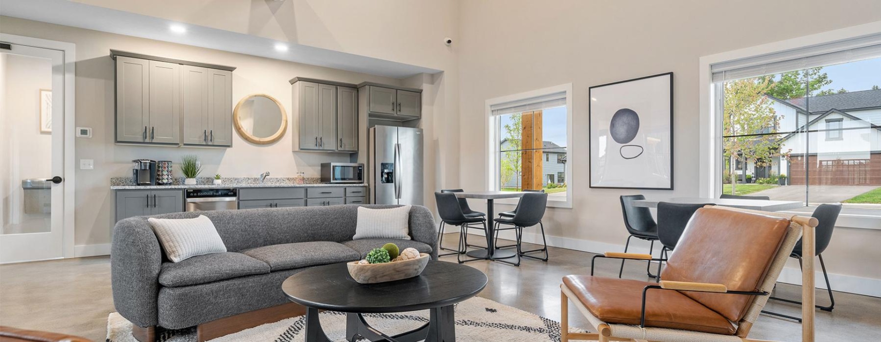 a living room with a couch and chairs