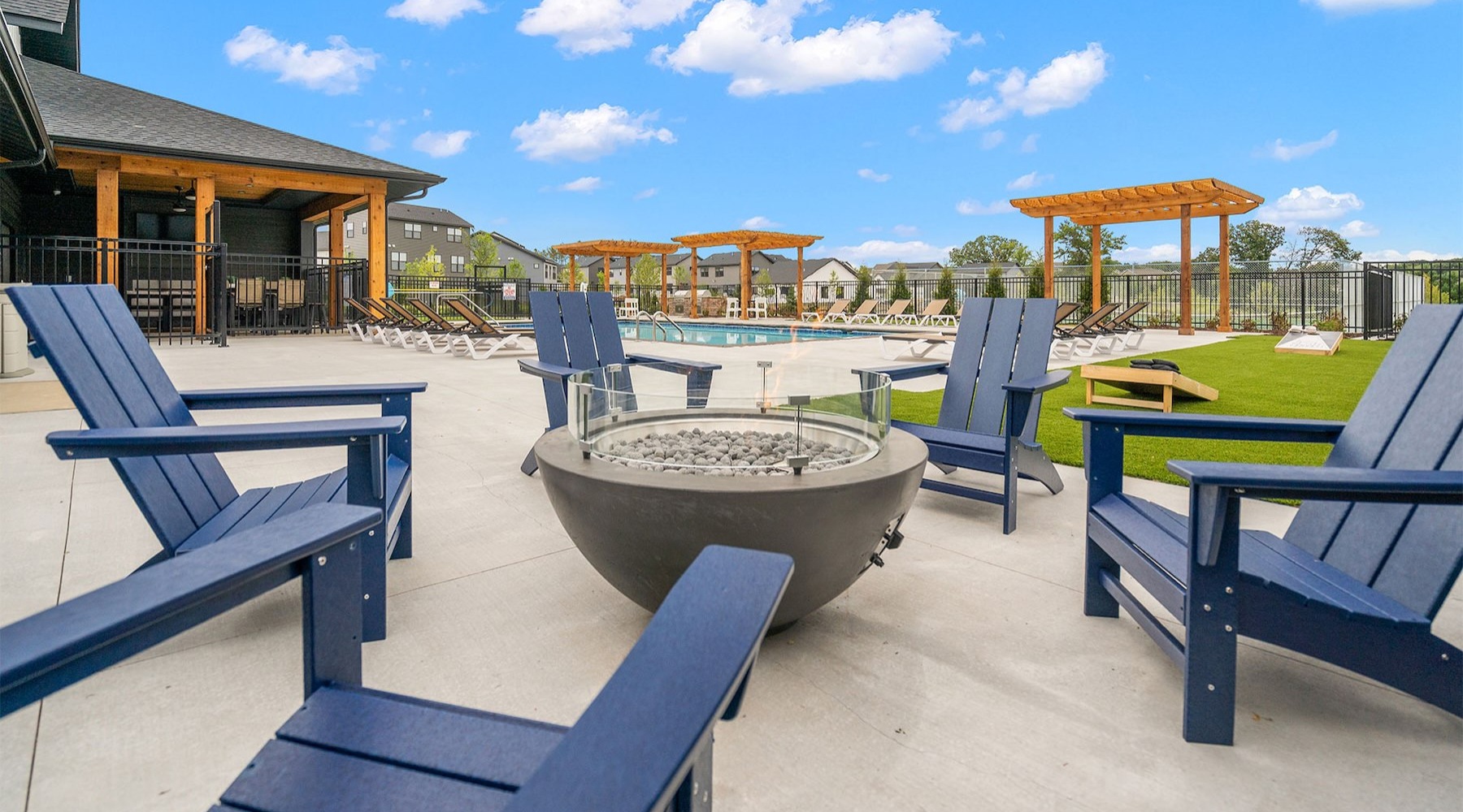 Adirondack chairs around a fire pit