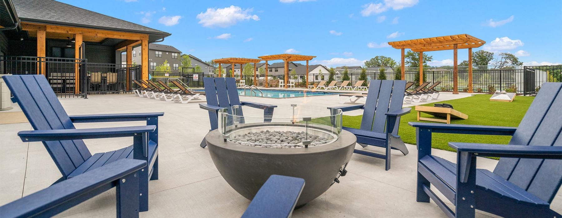 a group of blue chairs and a table outside