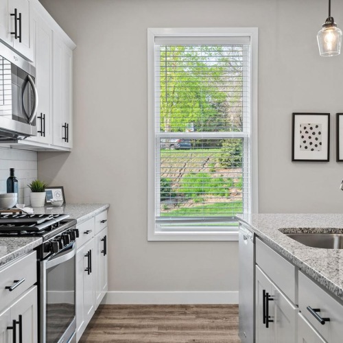 a kitchen with white cabinets