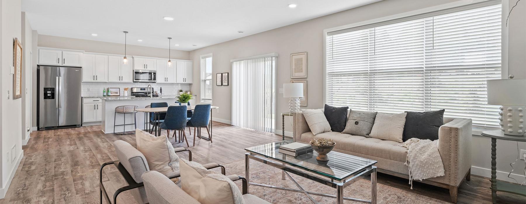 a living room with a large kitchen